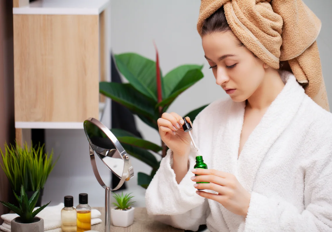 Woman applying Hyaluronic acid Serum at night