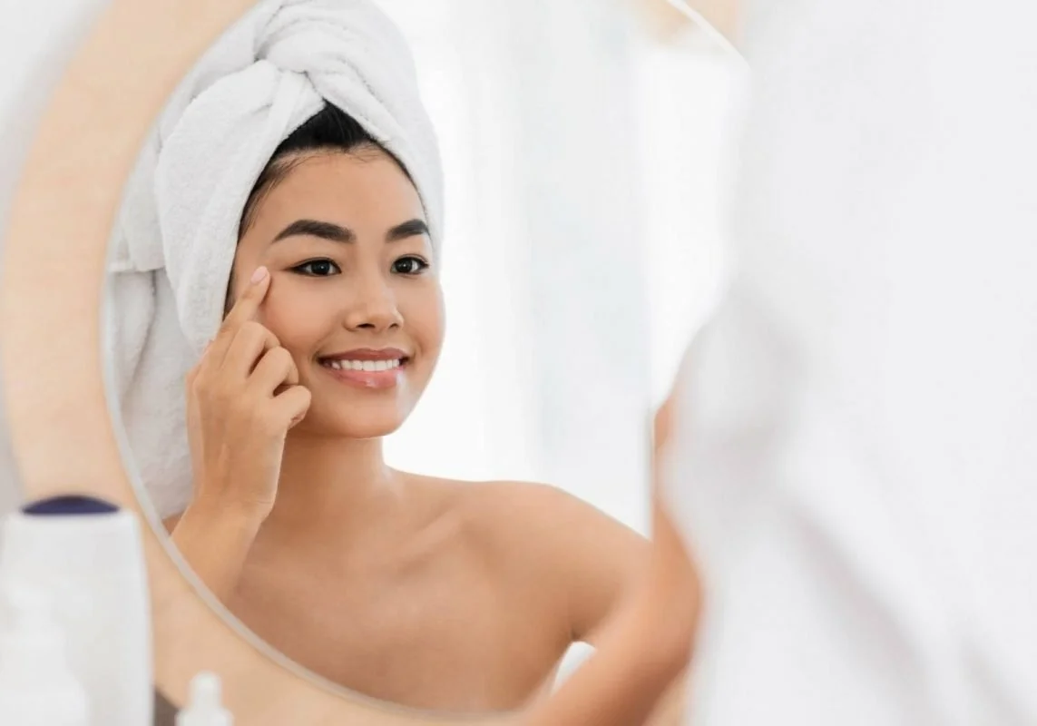Woman Applying Skincare Cream