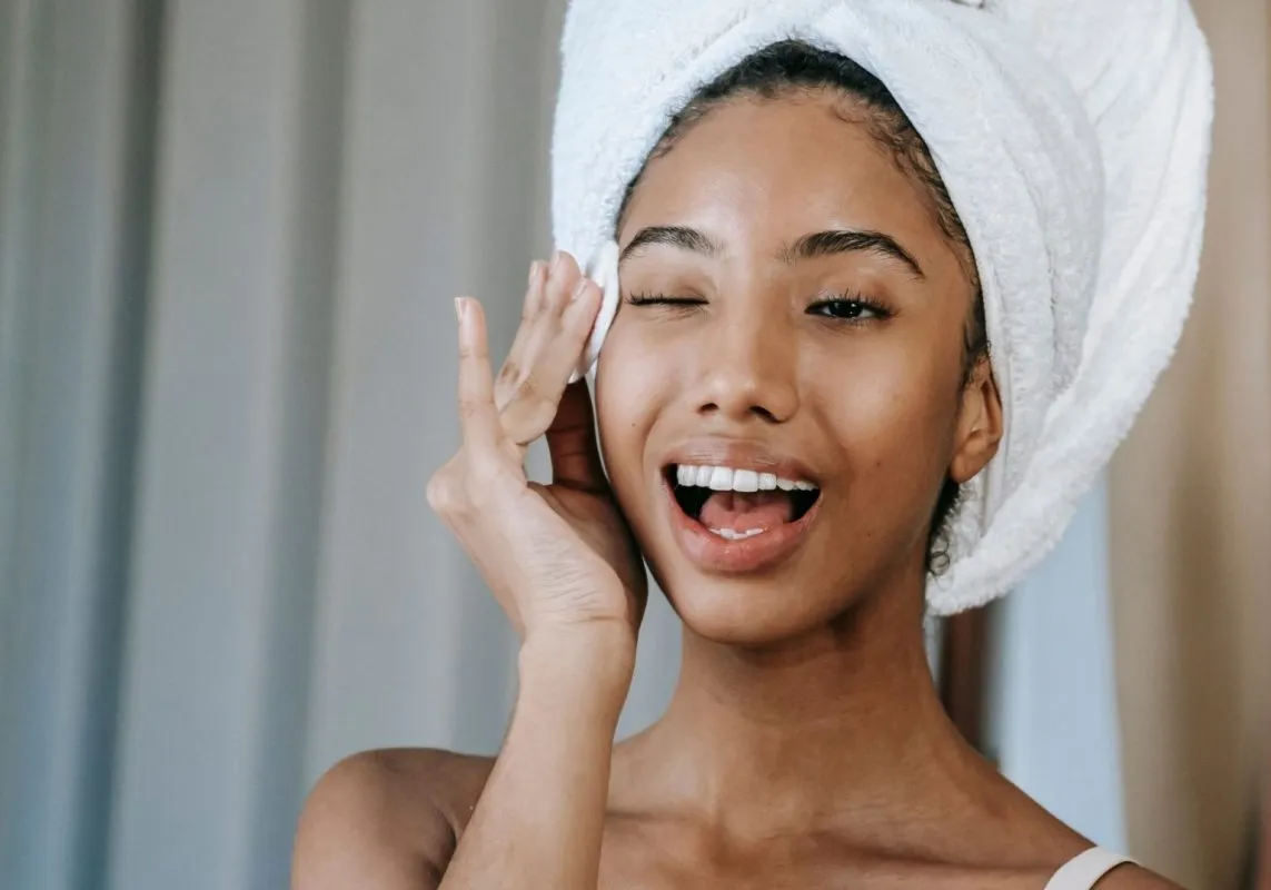African American Model Applying Skincare Cream