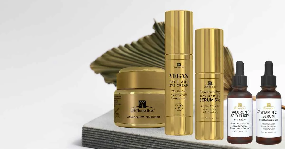 Luxurious display of WENmedics antioxidant skincare products, including Vitamin C Serum and Hyaluronic Acid Elixir, arranged on a bathroom counter.